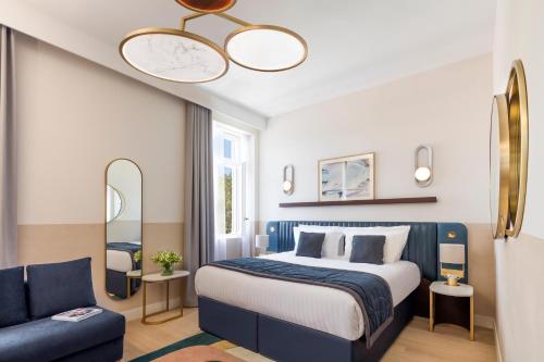 Ένα ή περισσότερα κρεβάτια σε δωμάτιο στο Maison Albar Hotels L’Imperator