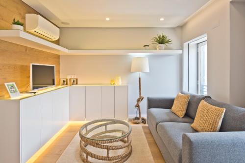 a living room with a couch and a table at BmyGuest Bruno’s 36 Apartments in Lisbon
