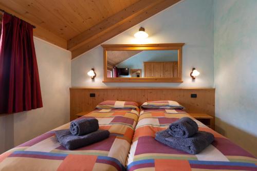 Кровать или кровати в номере La Grolla Rooms & Apartments