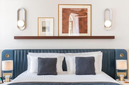Ένα ή περισσότερα κρεβάτια σε δωμάτιο στο Maison Albar Hotels L’Imperator