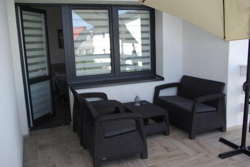 Posezení v ubytování Skarbek Iława, pokoje i apartamenty