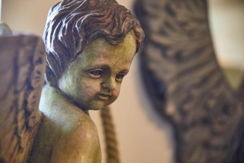 a statue of a young girl is on display at Le Pré de l'Aube in Montjoyer
