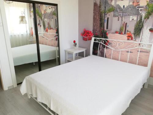 En eller flere senge i et værelse på Villa Dolce Vita