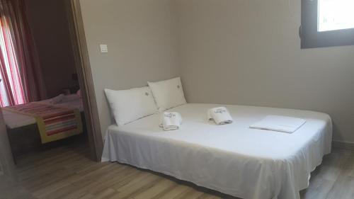 Ένα ή περισσότερα κρεβάτια σε δωμάτιο στο Paramithi Luxury Apartments