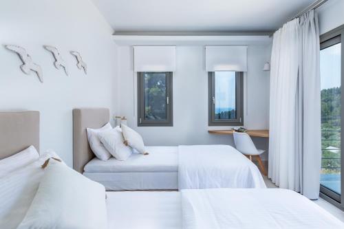 Postel nebo postele na pokoji v ubytování Elios Private Living