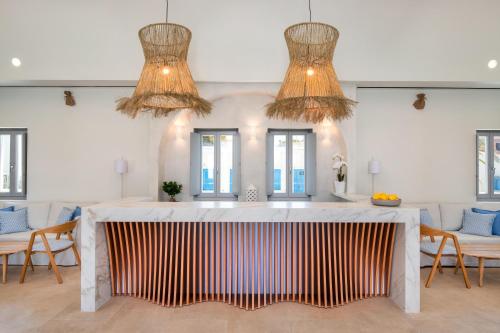 a dining room with a table and chairs at Meltemi Blu - Adults Only in Perissa