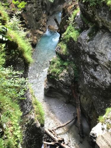 a small stream in a rocky area with rocks and trees at Klippitzhimmel in Klippitztorl