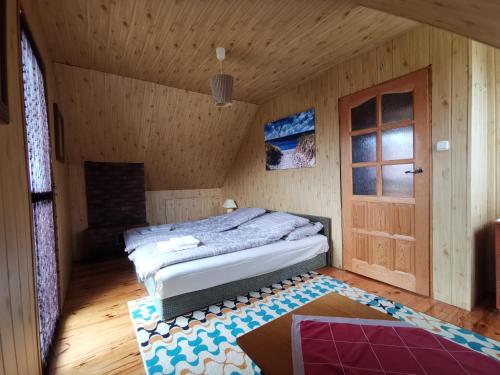 Llit o llits en una habitació de Domek Gunia