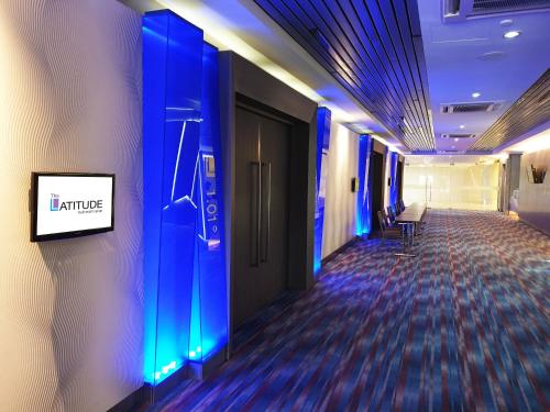 a hallway with blue lights on the wall of a building at Hotel Armada Petaling Jaya in Petaling Jaya
