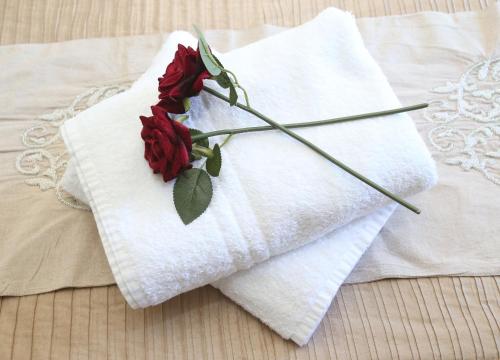 a red rose sitting on top of a white towel at No 2 in Kirkby Lonsdale