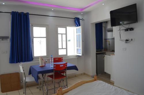 Телевизор и/или развлекательный центр в Tunisia Queen Apartment