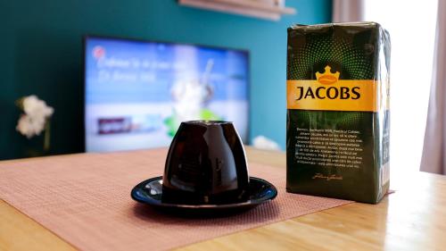 a can of jacobs coffee sitting on a table at UNIRII OLD SQUARE APARTMENTS 4 in Timişoara