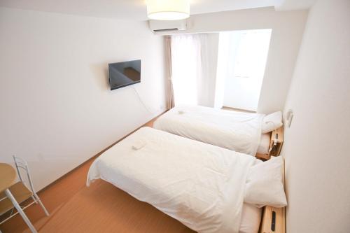 Łóżko lub łóżka w pokoju w obiekcie Connect Inn