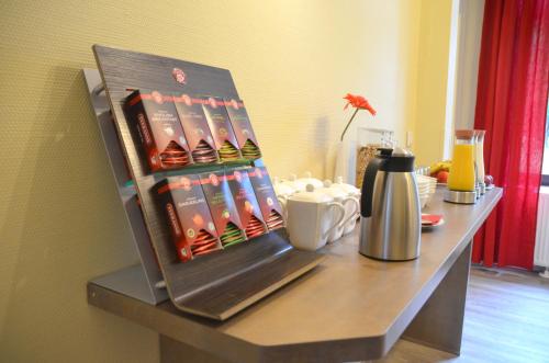 a table with a display of drink bottles on it at Hotel Villa Kisseleff in Bad Homburg vor der Höhe
