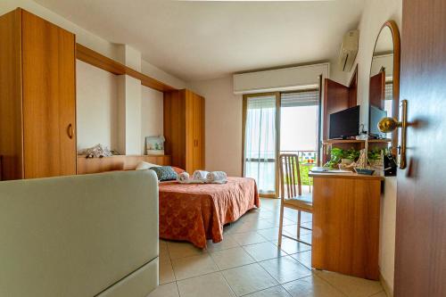 Postel nebo postele na pokoji v ubytování Hotel Ascot