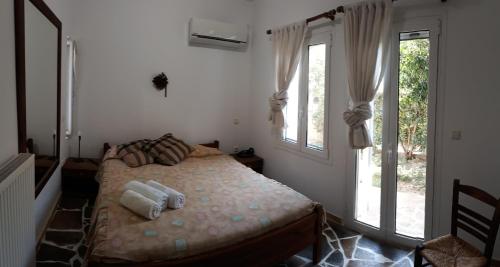 Ένα ή περισσότερα κρεβάτια σε δωμάτιο στο Peggy's house