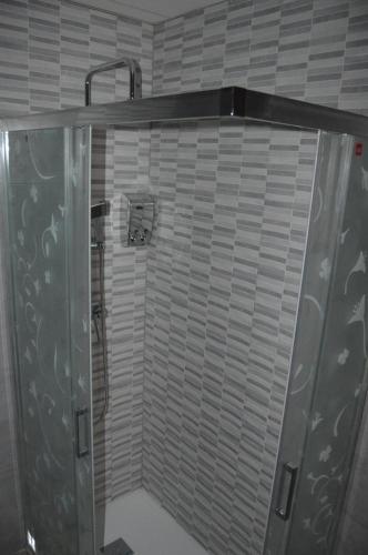 a shower with a glass door in a bathroom at apartamento agaete Beach 4a in Agaete