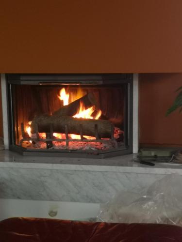 a fireplace with a fire in it at Homestay Free Park&Bikes in Ljubljana