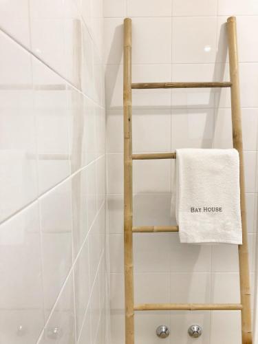 a towel on a towel rack in a bathroom at Bay House Baleal - surf beach across the road in Ferrel