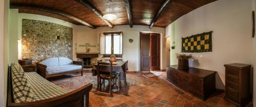 a living room with a couch and a table at Lolivia Masseria & Ristoro in Senise