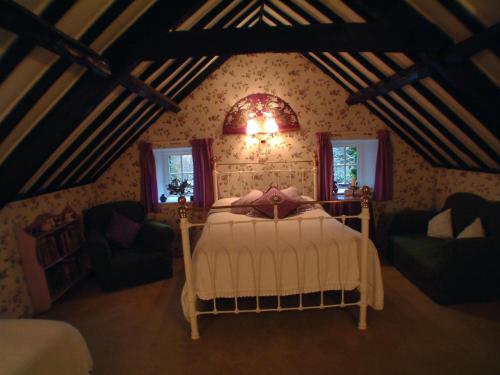 a bedroom with a bed in a attic at Cullintra House in New Ross