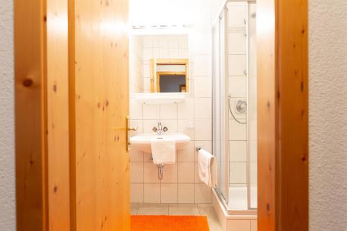 a bathroom with a sink and a mirror at Appartement Pirmin in Sölden