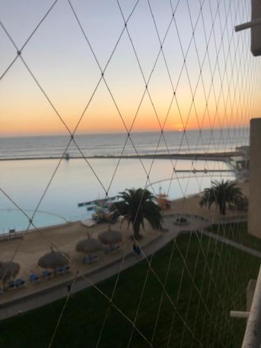 a view of the ocean from a balcony of a beach at Condominio San Alfonso del Mar in Algarrobo