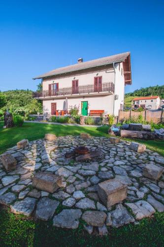 a large stone patio in front of a house at Farm stay Synergia - Hiden treasure in Pazin