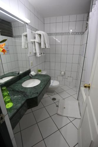 a bathroom with a sink and a toilet at Plaza Mayor Hotel in Puno