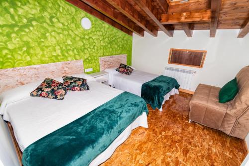 Ένα ή περισσότερα κρεβάτια σε δωμάτιο στο Albergue Santa Marina