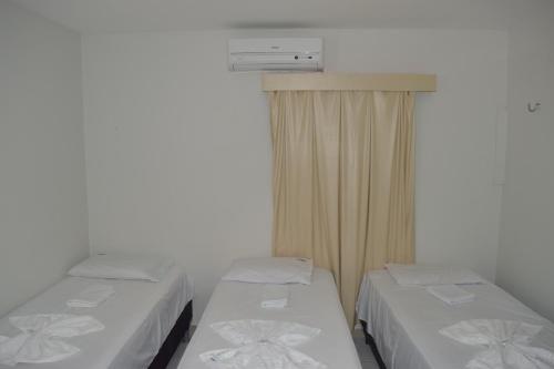 Ліжко або ліжка в номері Loura Pousada