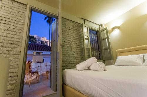 Posteľ alebo postele v izbe v ubytovaní Plaka360 Apartments