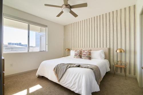 a bedroom with a bed and a ceiling fan at Sonder at Central Corridor in Phoenix