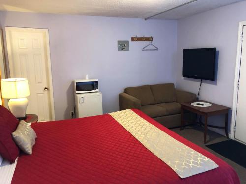 Кровать или кровати в номере Niagara Inn & Suites