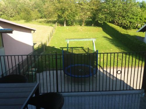 a view of a yard with a playground at Apartman Max 2 in Biškupec Zelinski