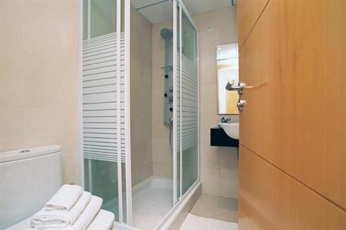 Ett badrum på Apartamentos Sitges
