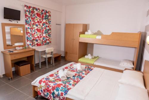 Posteľ alebo postele v izbe v ubytovaní Nikos Apartments