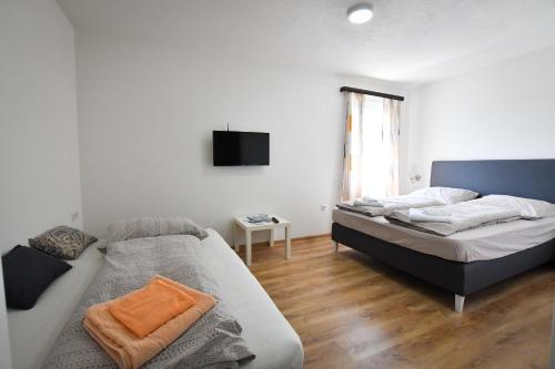 Postel nebo postele na pokoji v ubytování Vulsa Apartmani