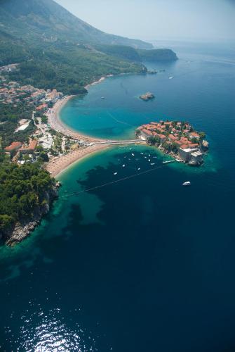 an aerial view of a small island in the water at Brand New Apartments - free parking in Sveti Stefan