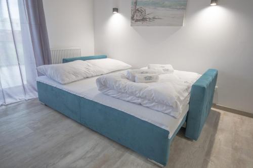 Posteľ alebo postele v izbe v ubytovaní Perfekt Apartments 5 Mórz Sianożęty