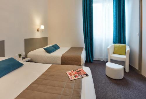 Ένα ή περισσότερα κρεβάτια σε δωμάτιο στο Hotel De La Pommeraie
