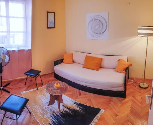 a living room with a couch and a table at Old Town Point in Budva