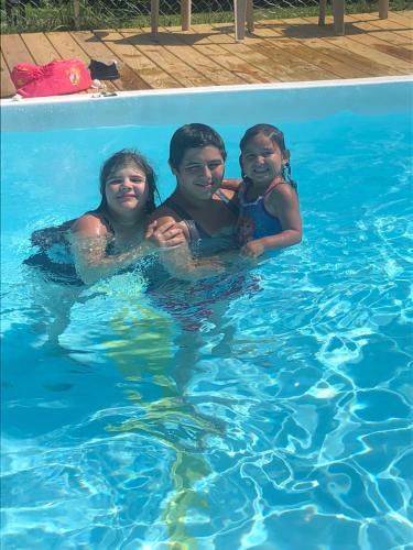 a couple of kids in a swimming pool at Chateau Tina in the Catskill Mountains in East Durham