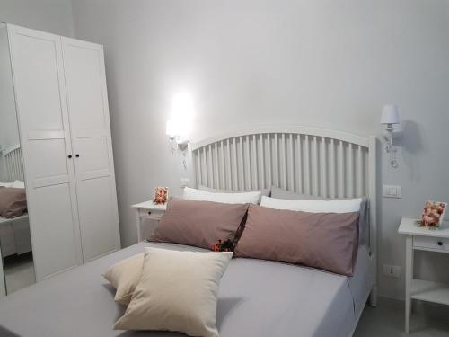 Katil atau katil-katil dalam bilik di Affitta Camere da Nonna Maria