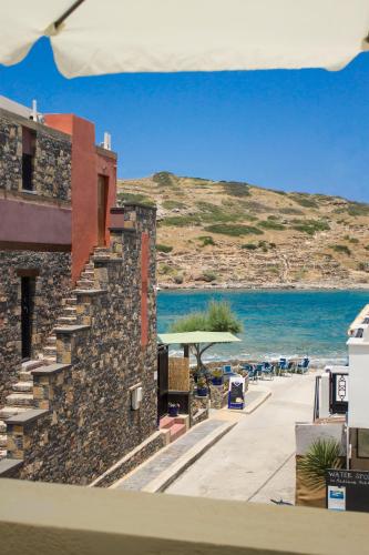 a view of the beach from a building at Sun & Sea in Mochlos