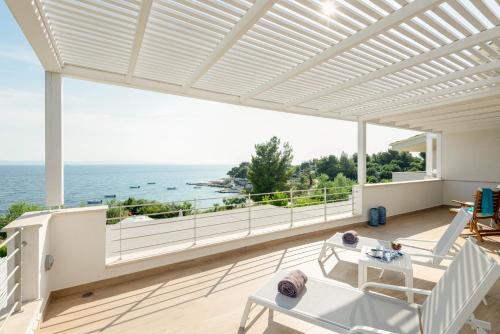 a patio with a view of the ocean at Akti Elia Villas Beachfront Chalkidiki in Elia