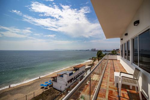 a view of the beach from the balcony of a house at The Paramar Beachfront Boutique Hotel With Breakfast Included - Downtown Malecon in Puerto Vallarta