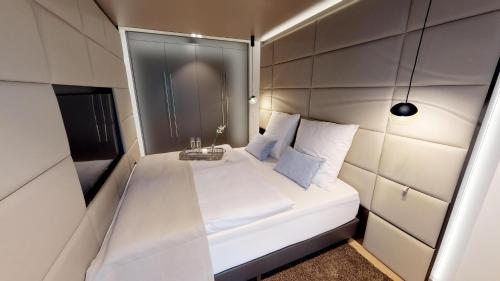 Postel nebo postele na pokoji v ubytování White Pearl Apartment 1.10