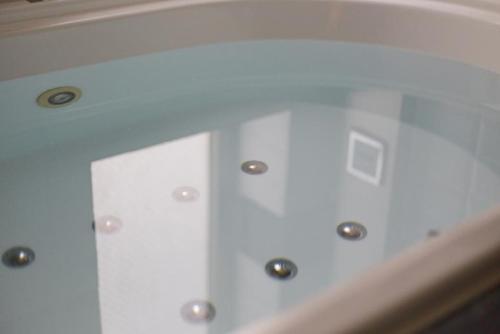 a room with a white ceiling with lights on it at Gifu UN(Adult Only) in Gifu