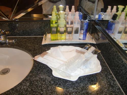 a bathroom counter with a sink and a mirror at Hotel GOLF Nirasaki (Adult Only) in Nirasaki